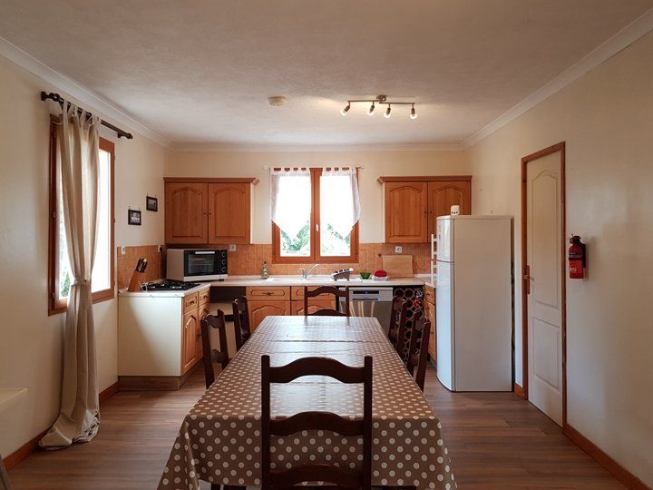 a dining table in a kitchen
