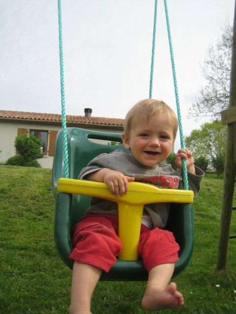 toddler on a baby swing
