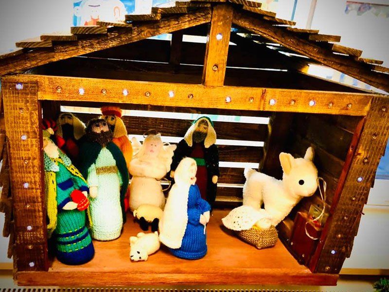 A small nativity scene with soft woollen characters