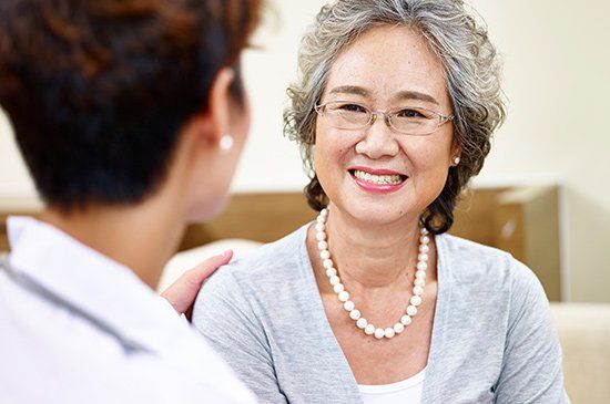 Ligation — Senior Woman Talking To Family Doctor in Manchester, NH Ligation — Senior Woman Talking To Family Doctor in Manchester, NH