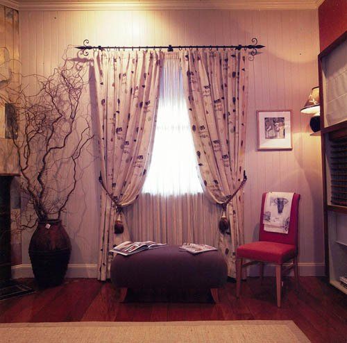 room with patterned curtains