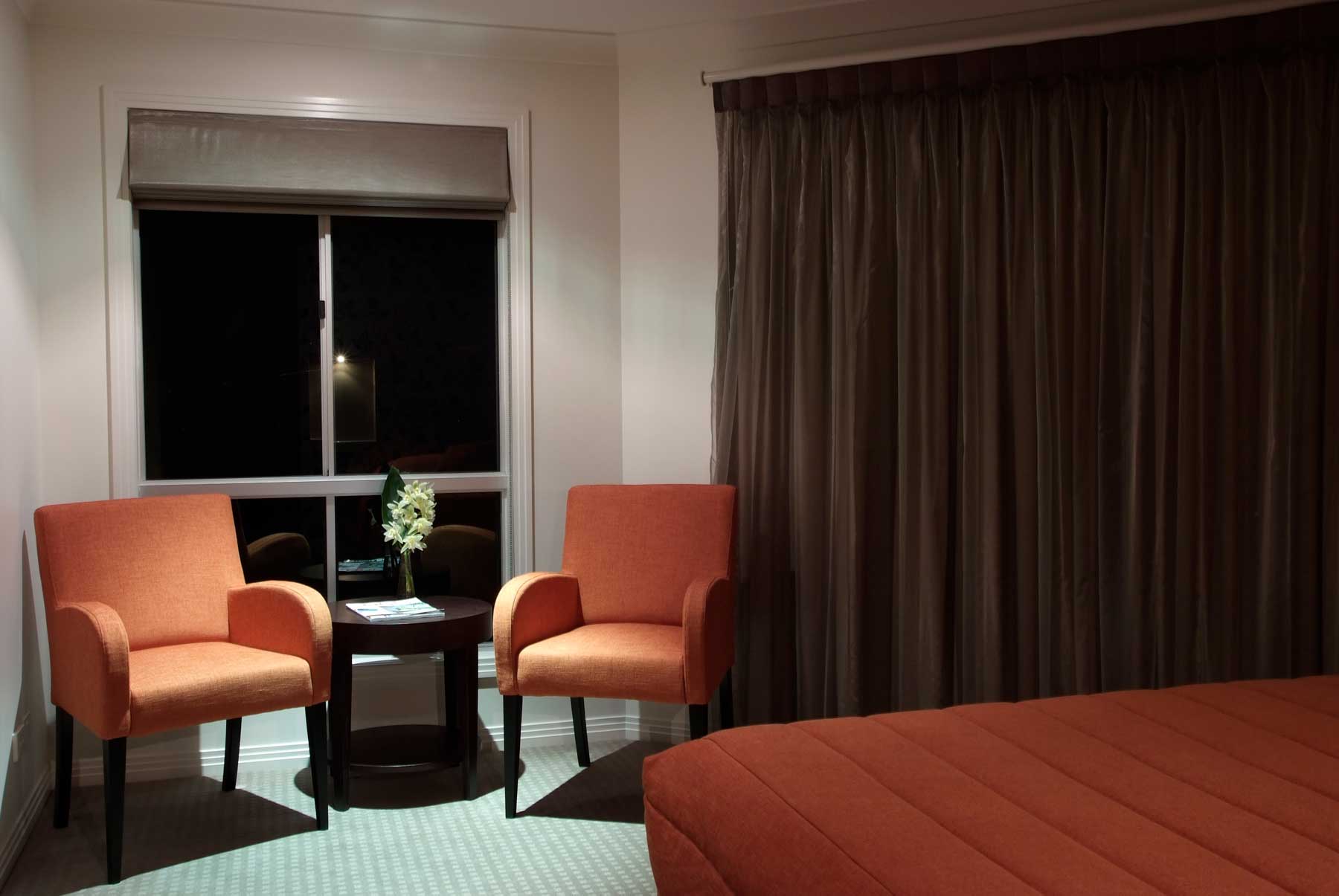 sitting area with orange chairs