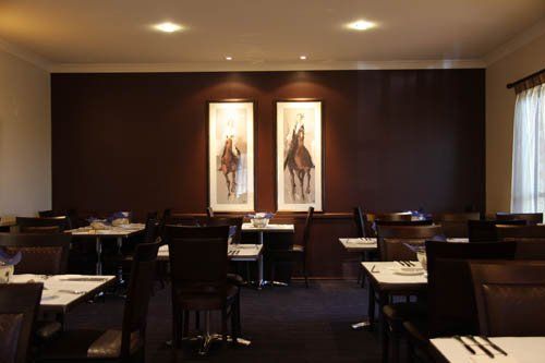 restaurant with dark walls and dim lighting