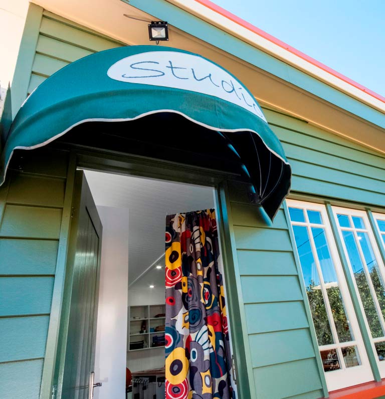 exterior of studio with blue siding