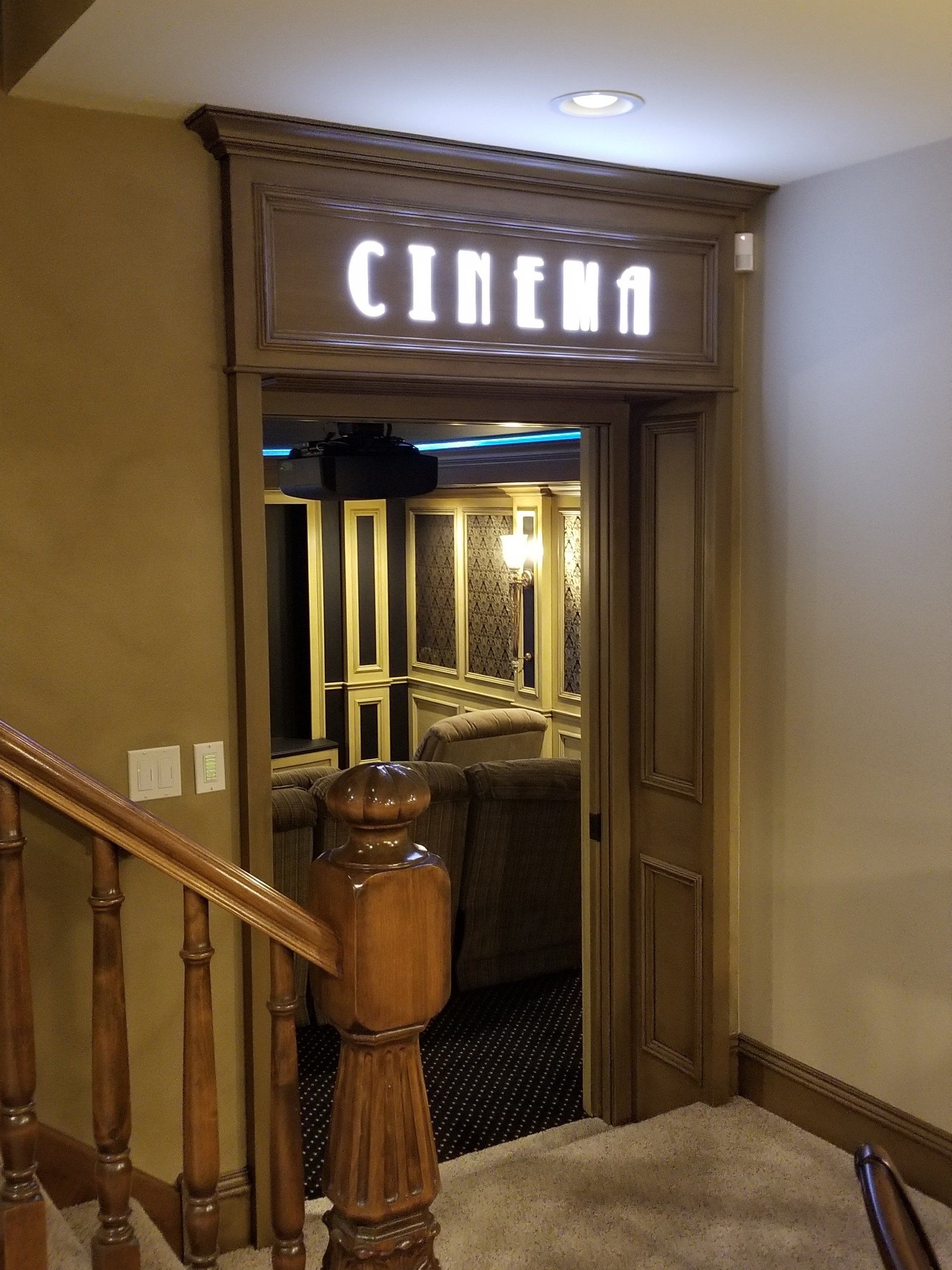 Wooden door to a cinema room with 