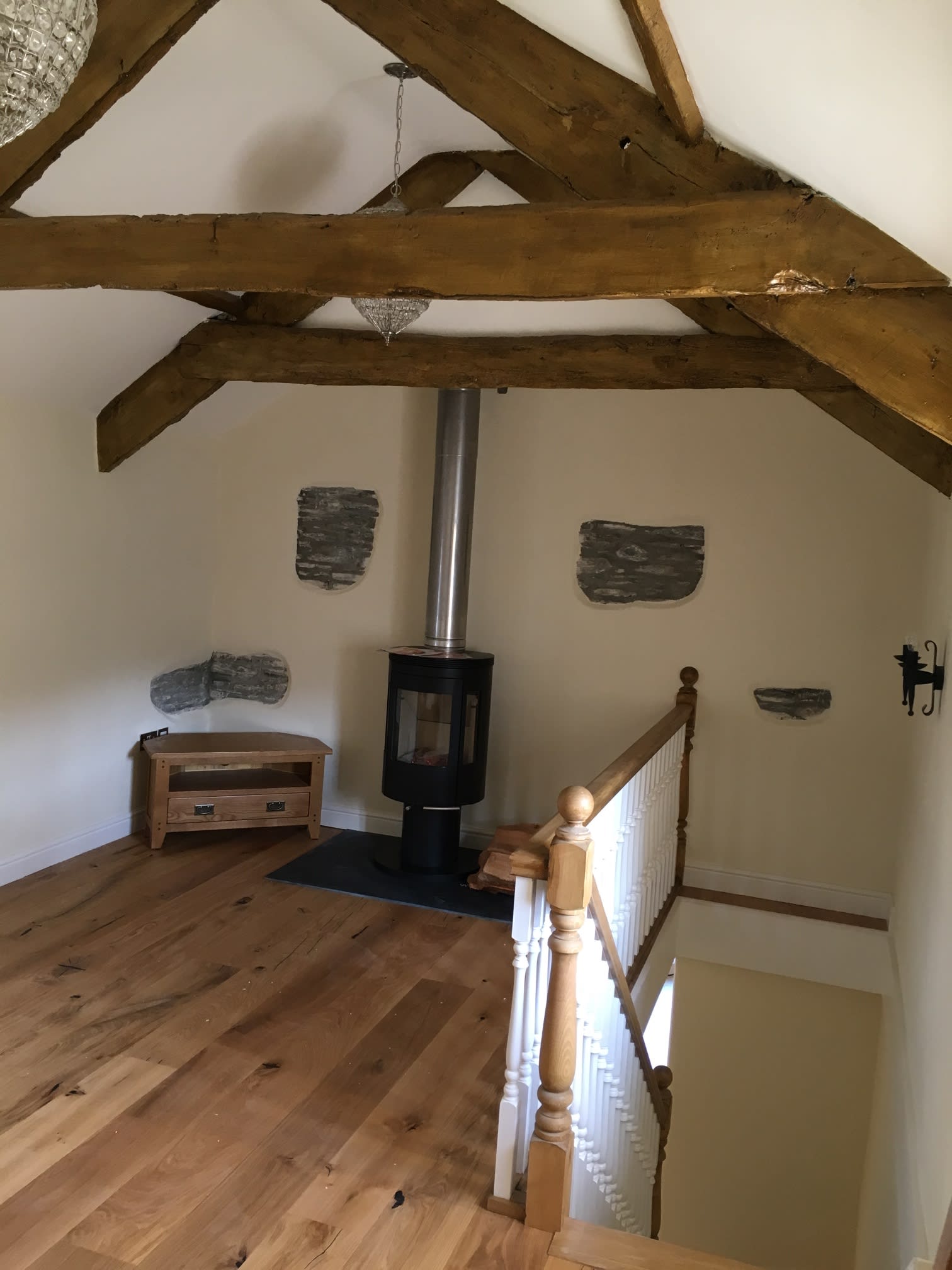 internal barn conversion with beams and wooden floor
