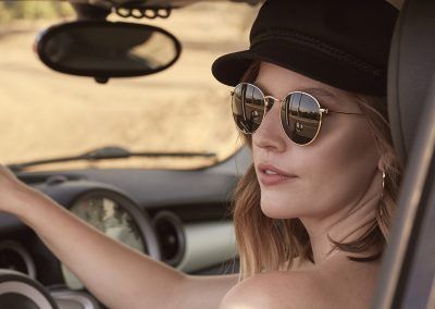 girl driving car with sunglasses