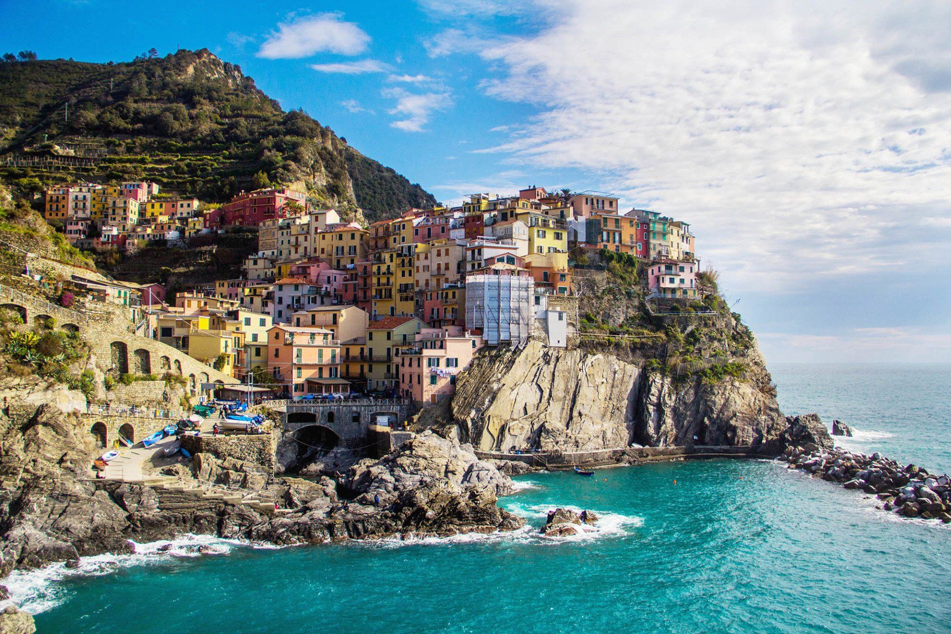 town on cliff side by ocean