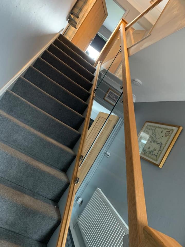 Stairs with wooden hand rail