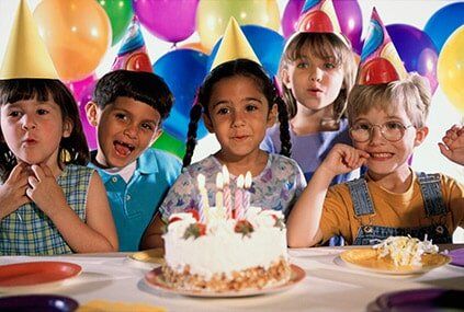 Children in front of a cake - One of our ice skating classes near Riverside, CA