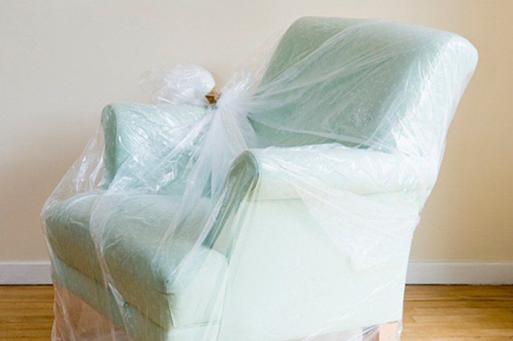 furniture wrapped in plastic