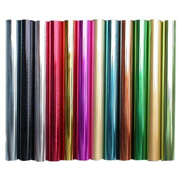 A bunch of different colored foil rolls on a white background.