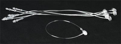 A bunch of strings and a ring on a black background