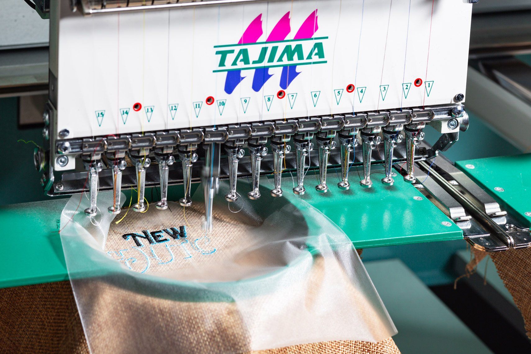 A tajima machine is embroidery a pair of socks