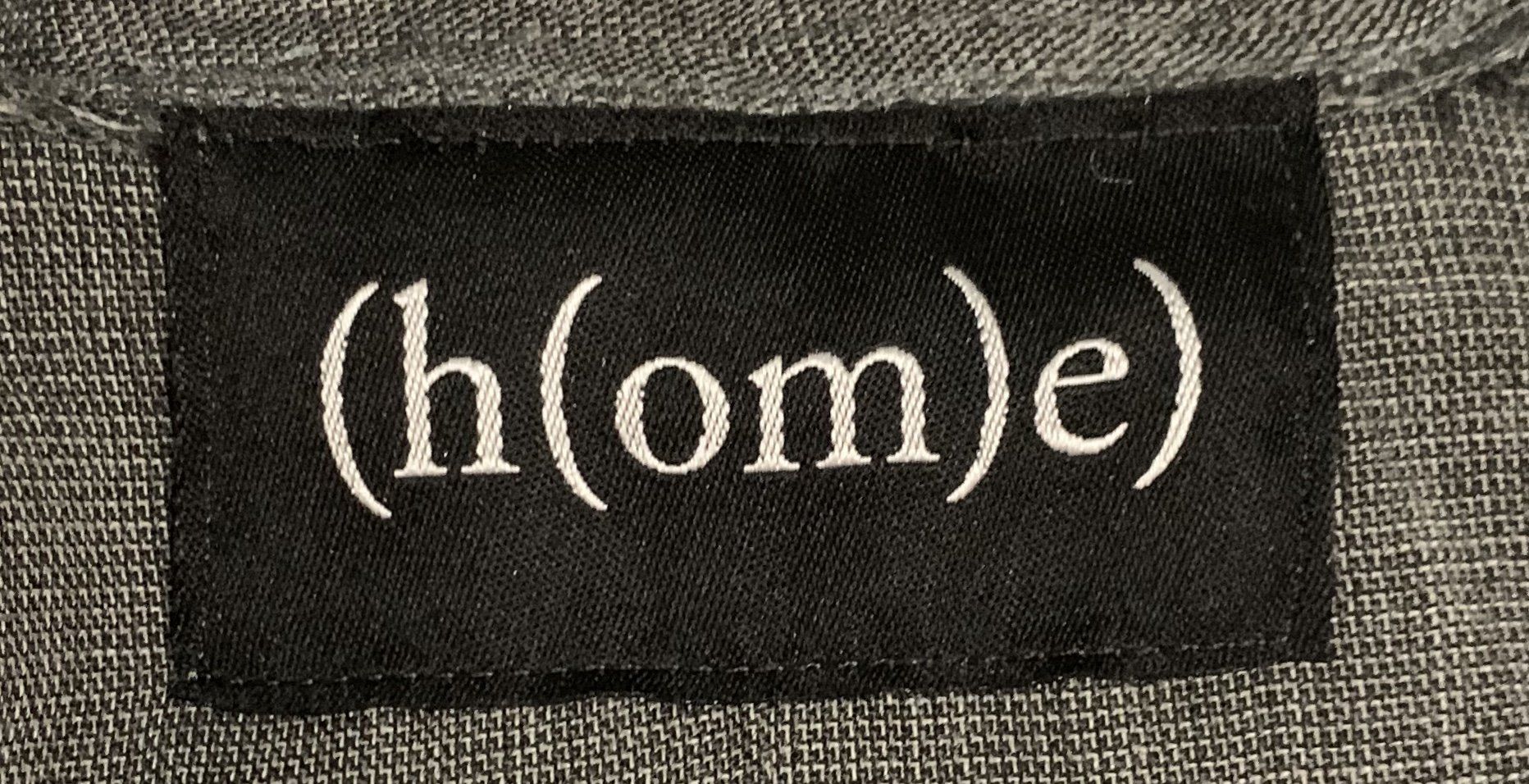 A black label with the word home on it
