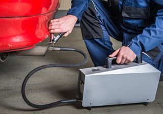 Emissions — Man Testing the Emission in Lansing, IL Emissions — Man Testing the Emission in Lansing, IL