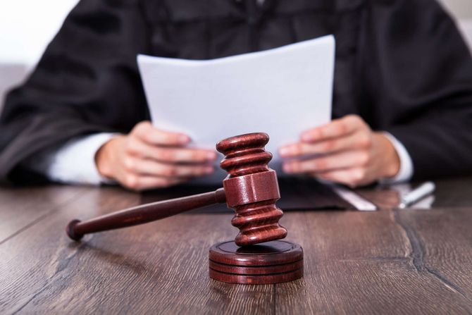 Judge Holding Documents - Law service in Dubuque, IA