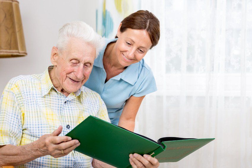 Nursing home: old man with caregiver