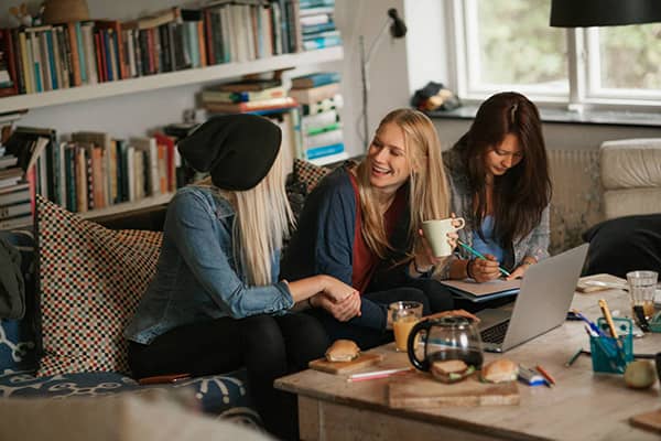 students talking in living room
