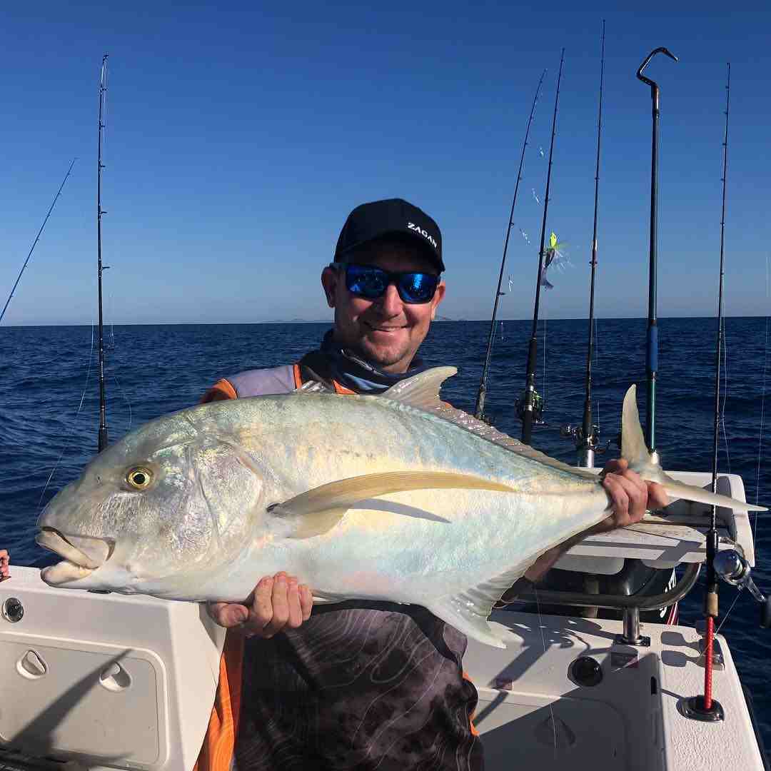 man holding fish — Fishing apparel Yeppoon in Yeppoon, QLD