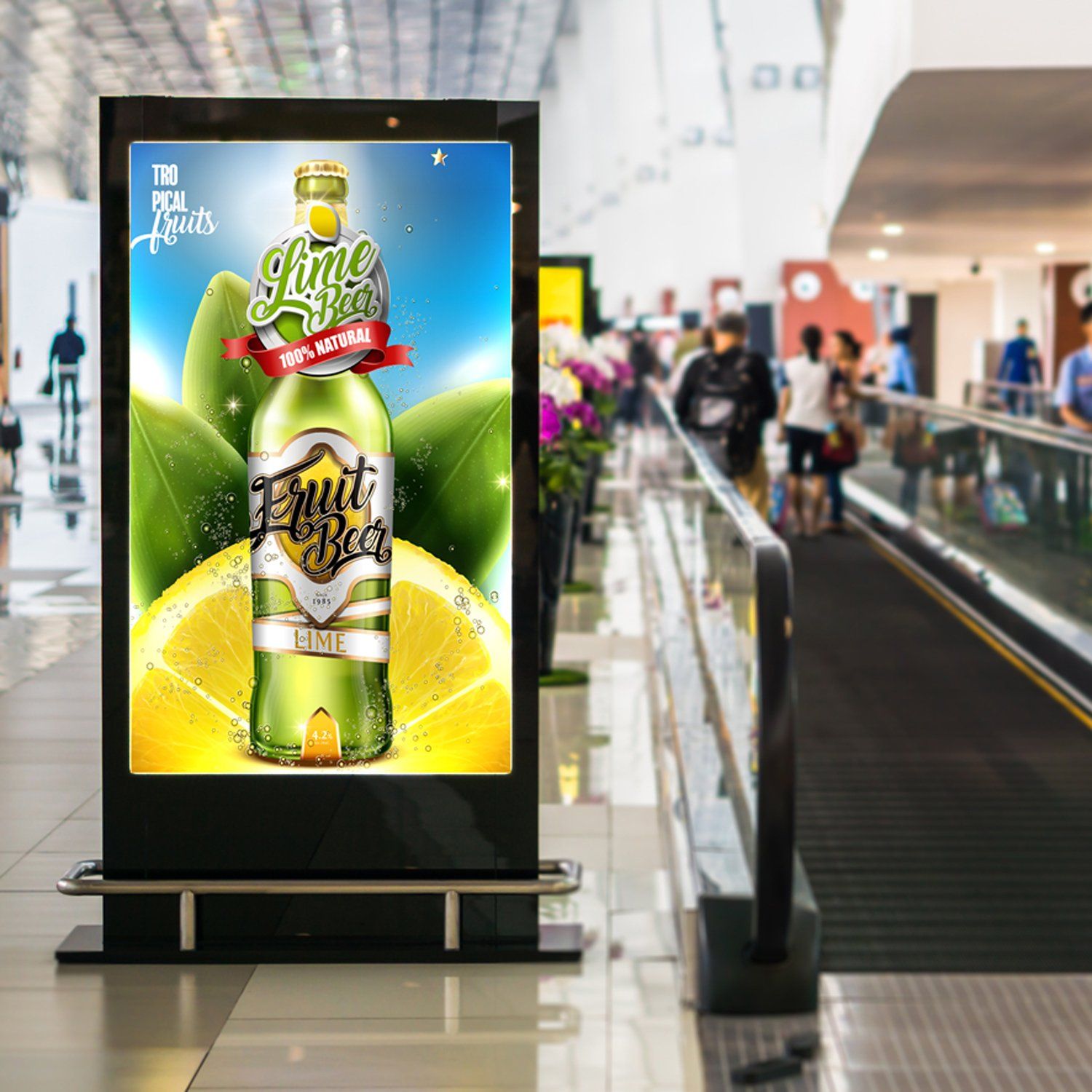 a bottle of fruit beer is on a sign in a mall