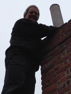 Employee Fixing Chimney - Chimney Cleaning in Norwood, MA Employee Fixing Chimney - Chimney Cleaning in Norwood, MA