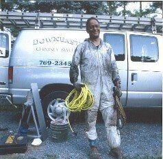 Employee With Dirty Overalls - Chimney Cleaning Services in Norwood, MA Employee With Dirty Overalls - Chimney Cleaning Services in Norwood, MA