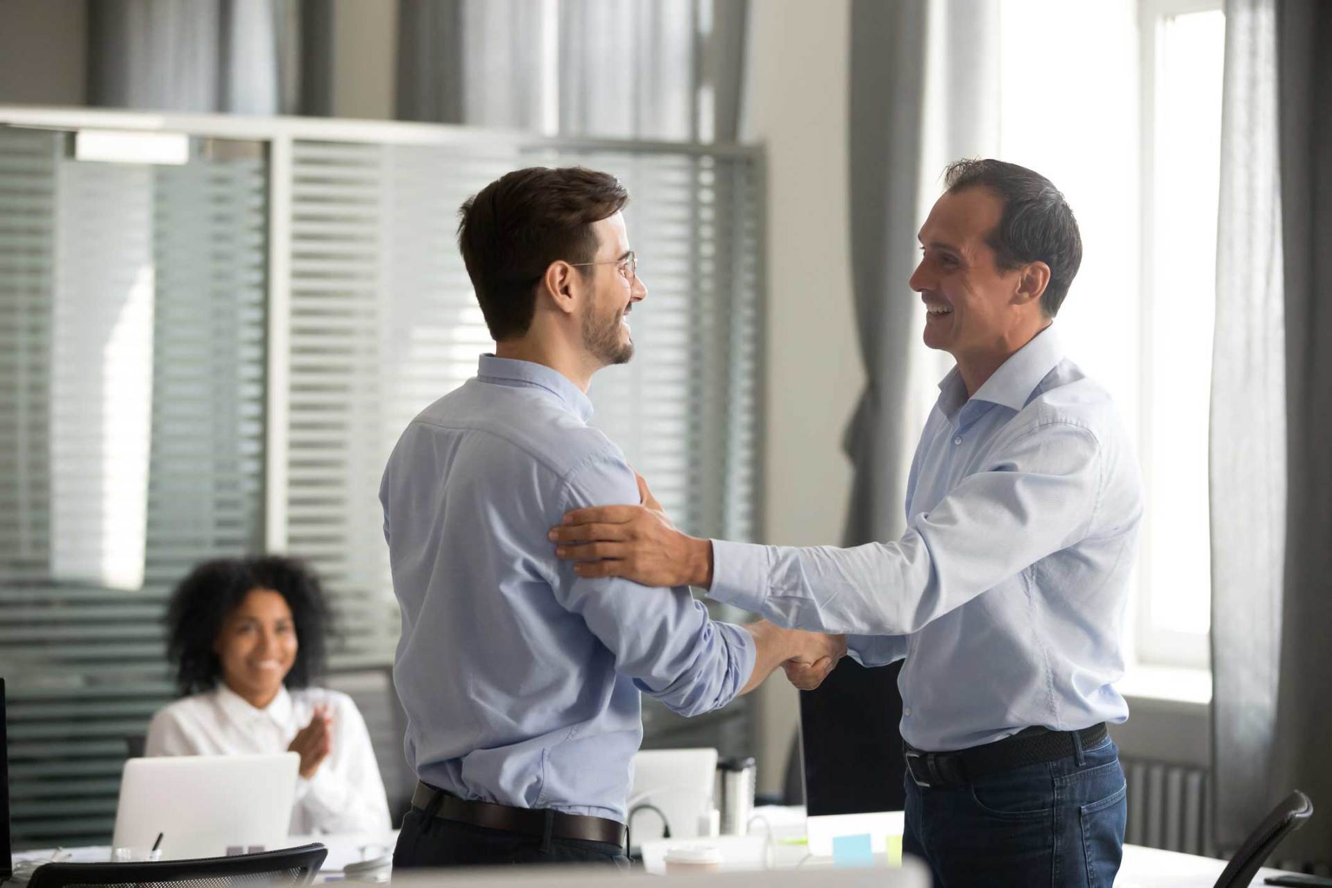 Employment Law — Two Male Worker Handshaking In Waynesville, NC Employment Law — Two Male Worker Handshaking In Waynesville, NC