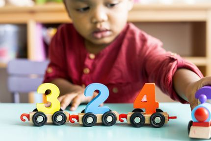 Two Year Old Girl Stacking Bricks — Philadelphia, PA — Learning World Child Academy Two Year Old Girl Stacking Bricks — Philadelphia, PA — Learning World Child Academy
