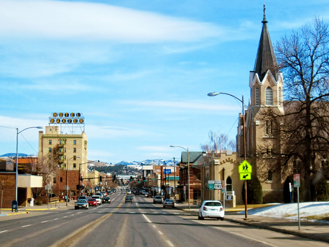 A city street with a church in the background