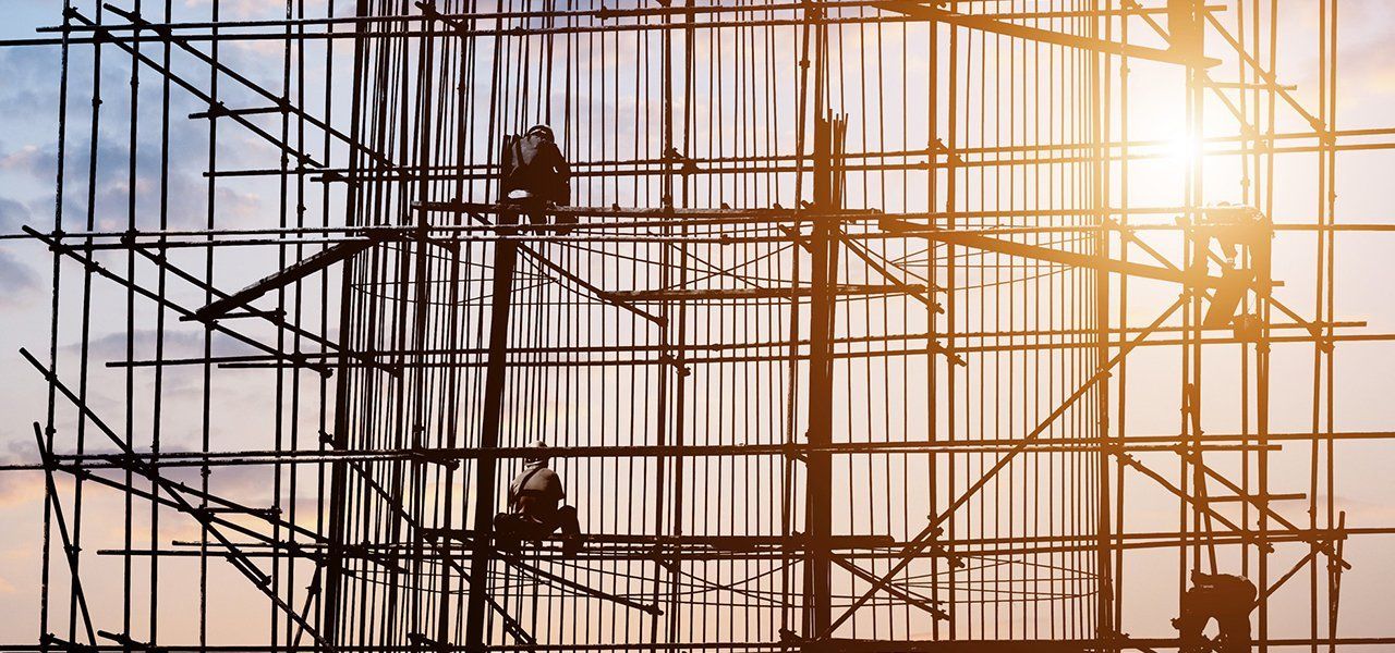 People constructing scaffold