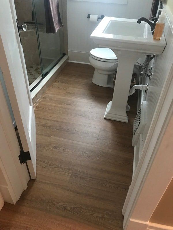 Bathroom with Sink — Luxury Vinyl Plank & Tile in Hamburg, NY