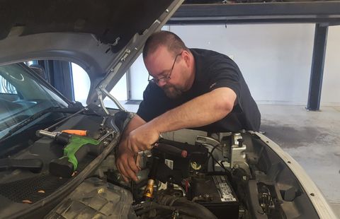 Auto Repair — Mechanic With Diagnostic Device in Goldsboro, NC Auto Repair — Mechanic With Diagnostic Device in Goldsboro, NC