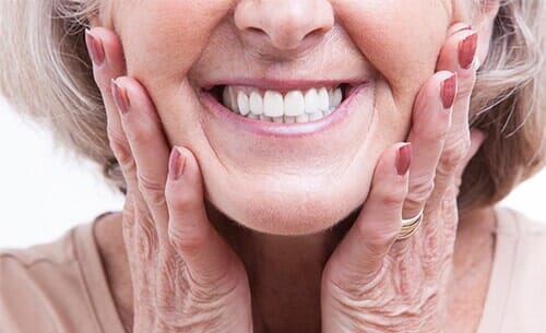 Senior Woman with Dentures—Cosmetic Dentistry in Moorpark, CA Senior Woman with Dentures—Cosmetic Dentistry in Moorpark, CA