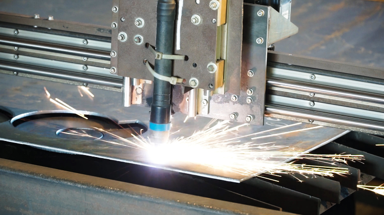Industrial cutting machine cutting metal with bright sparks