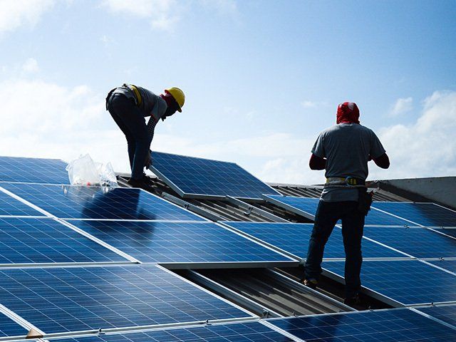 Installing Solar Panels — Orana Energy Systems in Dubbo, NSW Installing Solar Panels — Orana Energy Systems in Dubbo, NSW