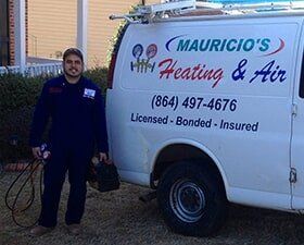 Cooling And Heating - Man Standing Near The Company Car in Spartanburg, SC Cooling And Heating - Man Standing Near The Company Car in Spartanburg, SC