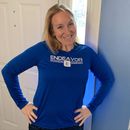 A woman wearing a blue shirt that says endeavor on it