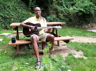 Man Playing Guitar