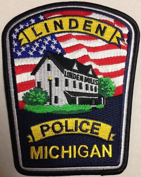 Linden, Michigan, Police Department patch with American flag, Linder Mills building, and text 