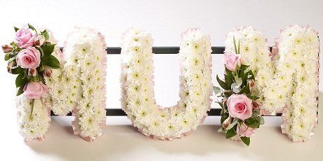 A flower arrangement spelling the word MUM A flower arrangement spelling the word MUM