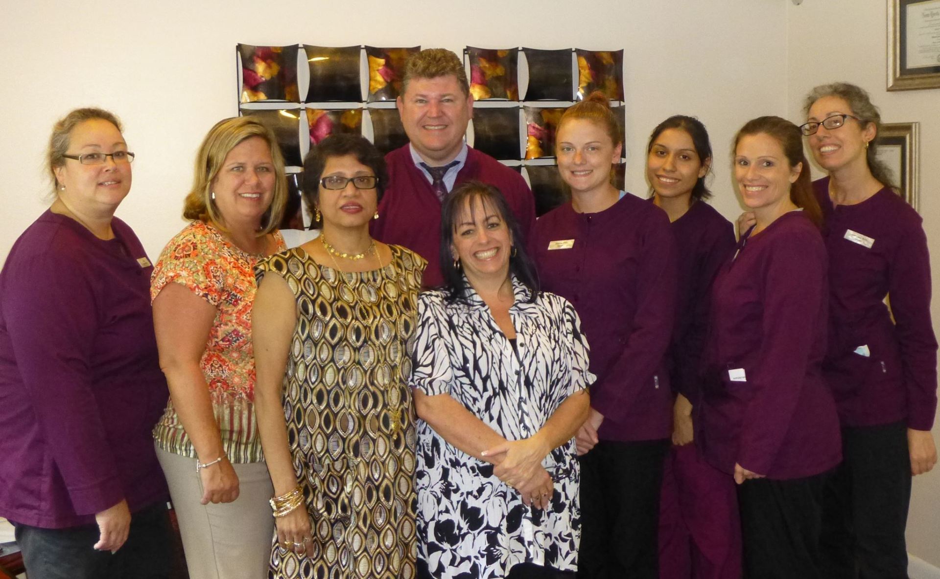 A group of people posing for a picture in purple uniforms