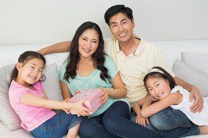 Family of four, smiling