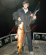 Man Holding a Freshly Caught Fish — Lancaster County, PA — Night Ventures Bowfishing Charters