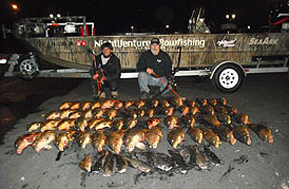 Two Men and Many Fish Laying on Ground — Lancaster County, PA — Night Ventures Bowfishing Charters