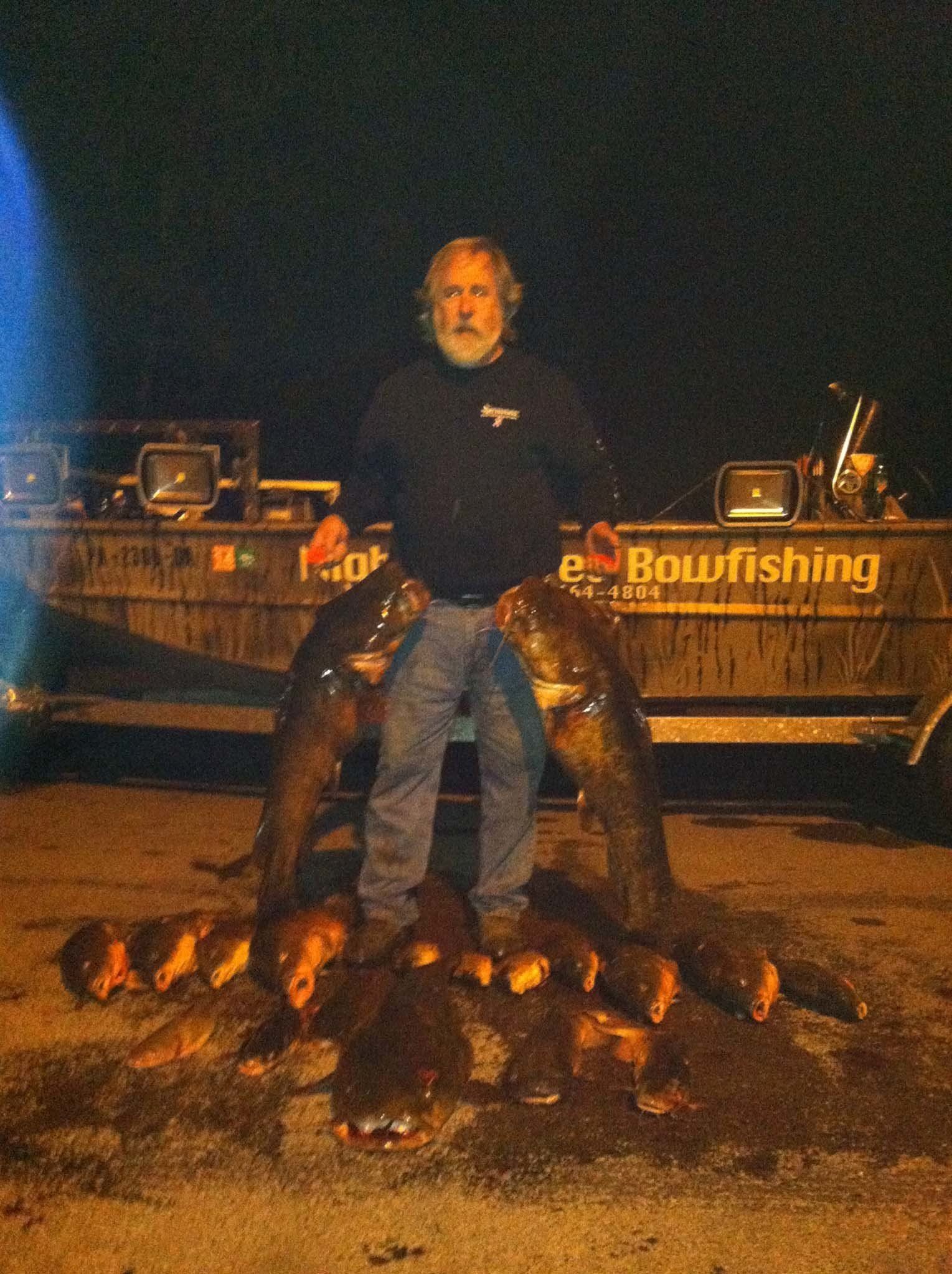 Man Holding a Two Catfish — Lancaster County, PA — Night Ventures Bowfishing Charters