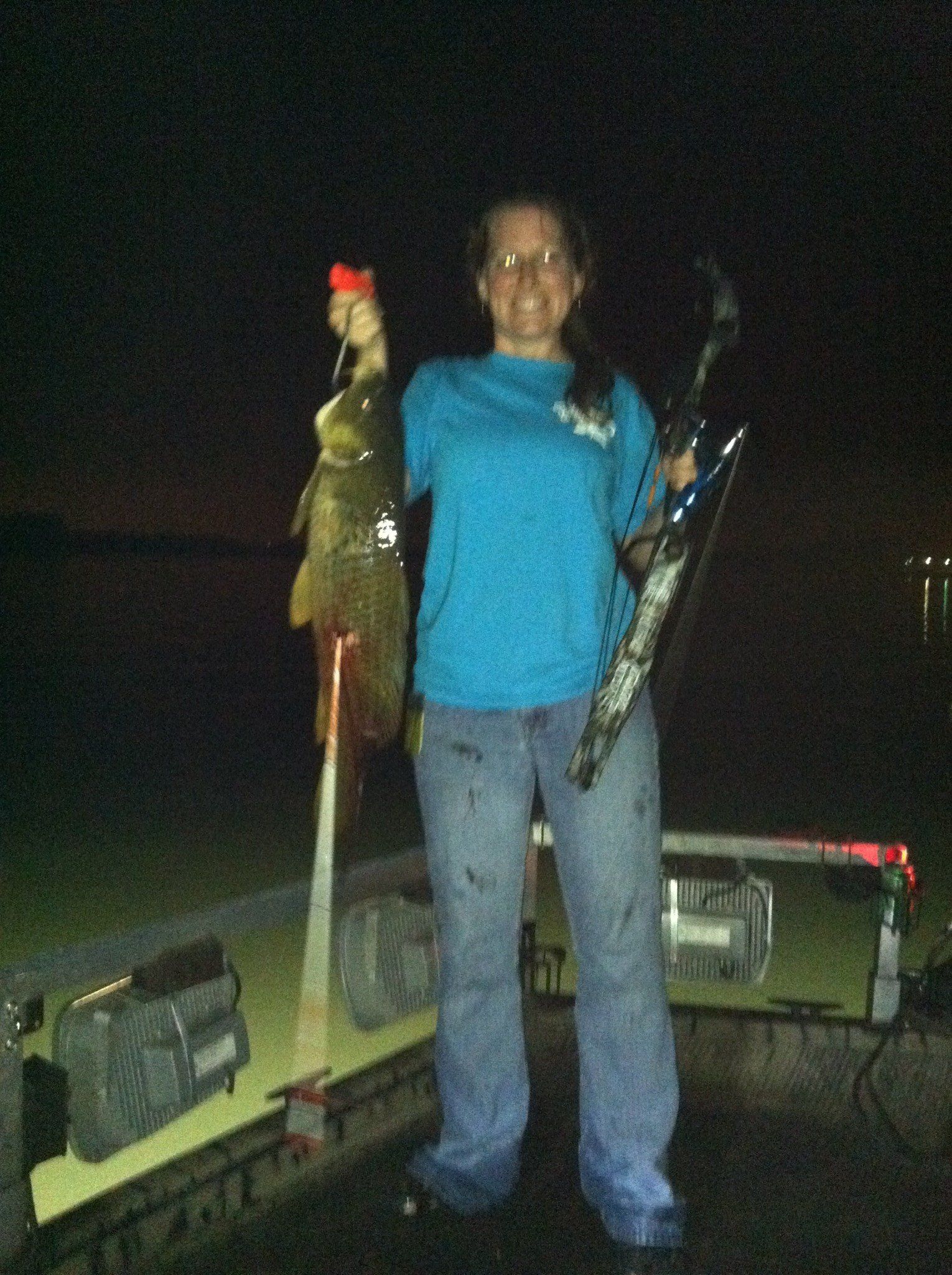 Woman in Blue Holding Her Caught Fish — Lancaster County, PA — Night Ventures Bowfishing Charters