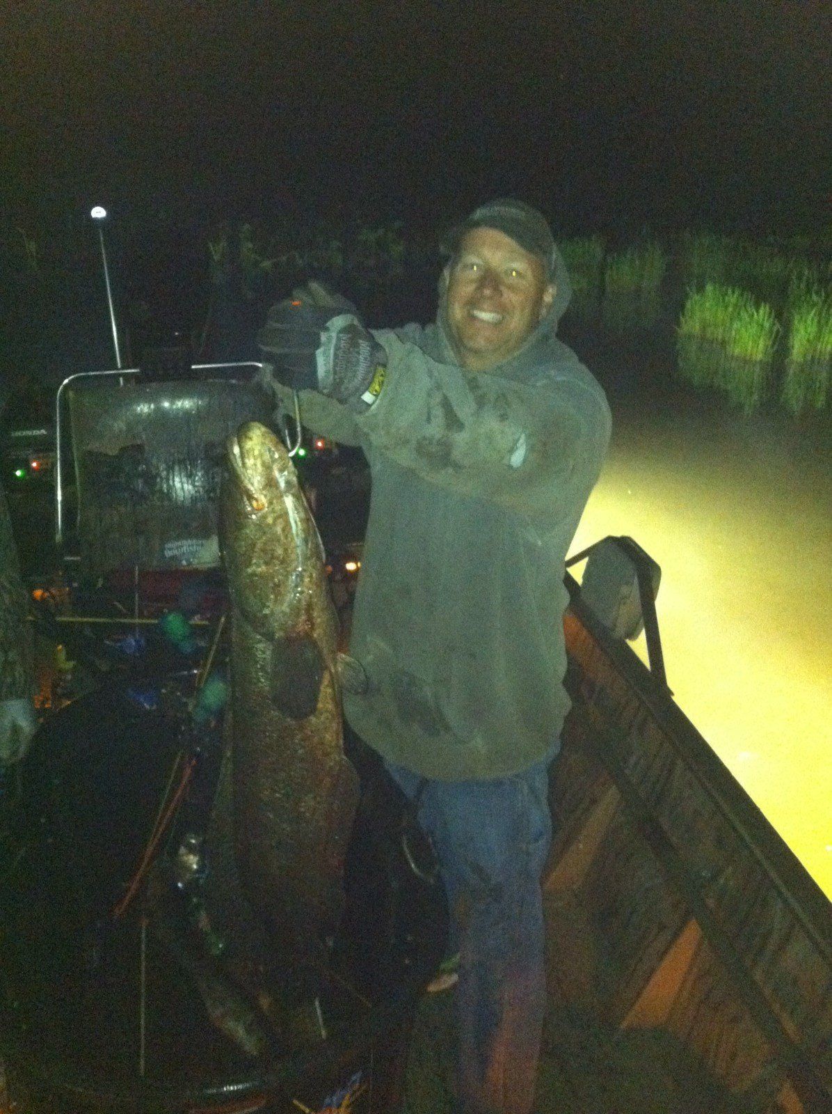 Man Holding a Large Catfish in a Hook — Lancaster County, PA — Night Ventures Bowfishing Charters