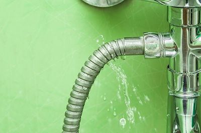 Plumbing — Damaged Leaking Water Tap Hose in Plainfield, CT Plumbing — Damaged Leaking Water Tap Hose in Plainfield, CT