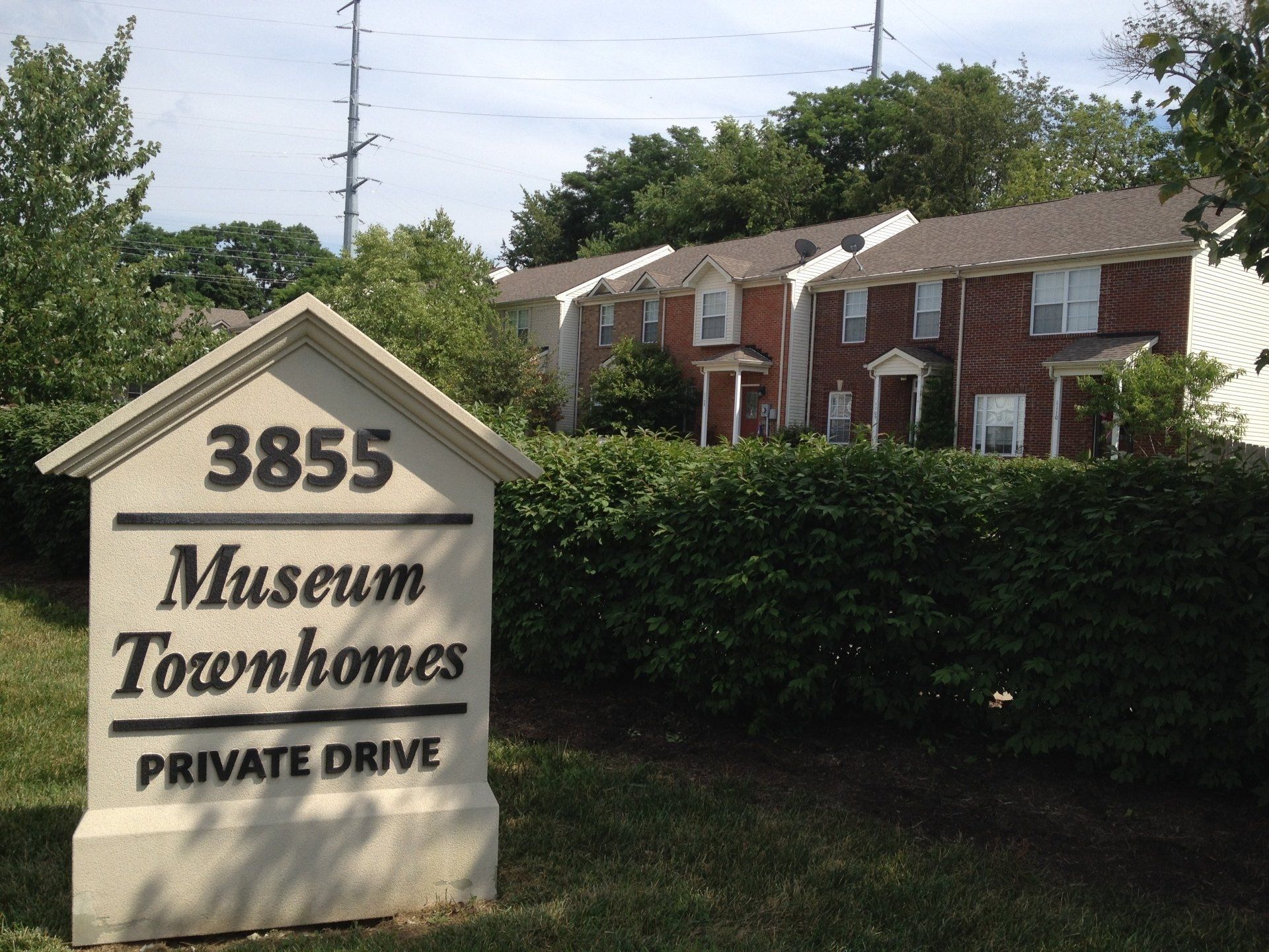 A sign that says museum townhomes on it